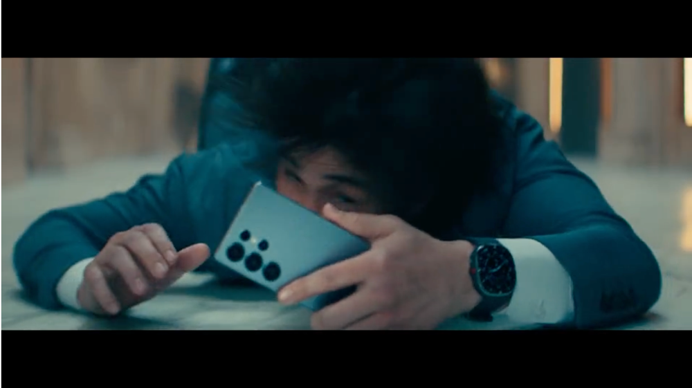 Samsung phone in mans hand