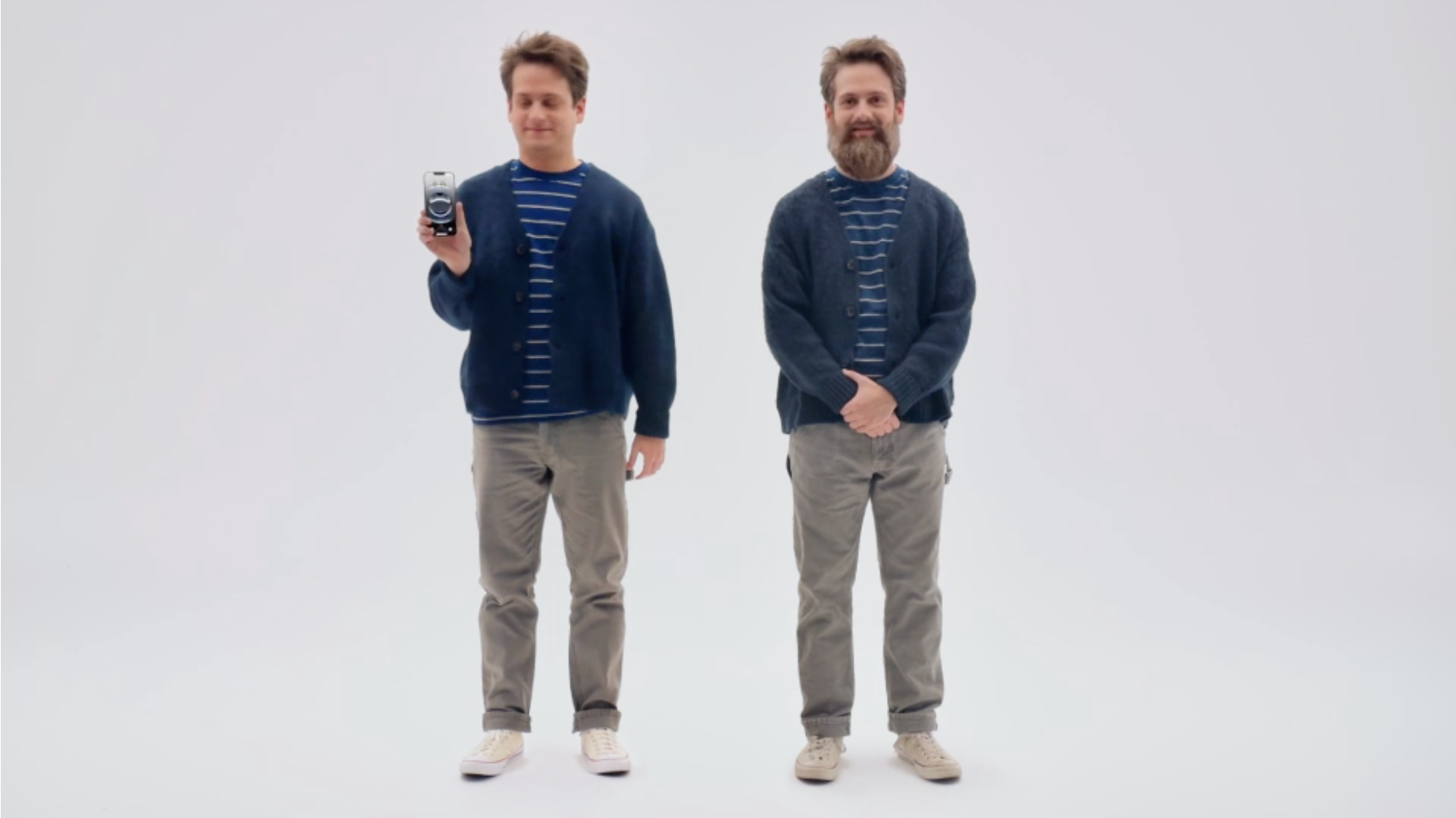 man holding iphone with twin